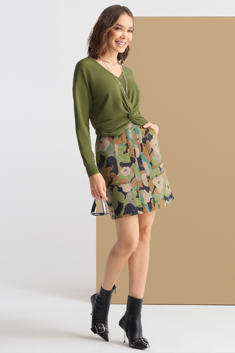 Model wearing Zipline Skirt in Camo, Turnaround Tee in Avocado, Timepiece Necklace in Silver and Gold