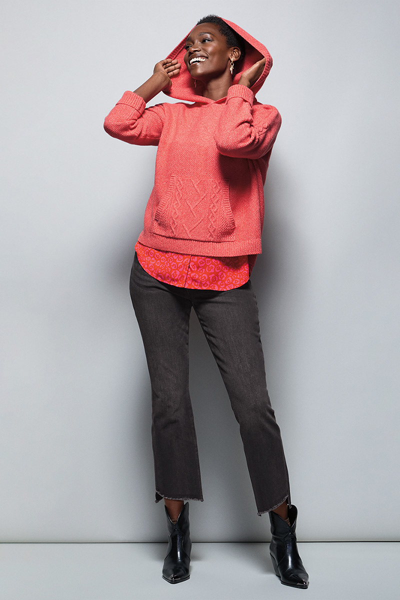 Model Wearing Sidekick Hoodie in Pink Frost, Kiss Top in Flower Bed, High-Low Crop in Washed Black, Fable Earrings in Gold.