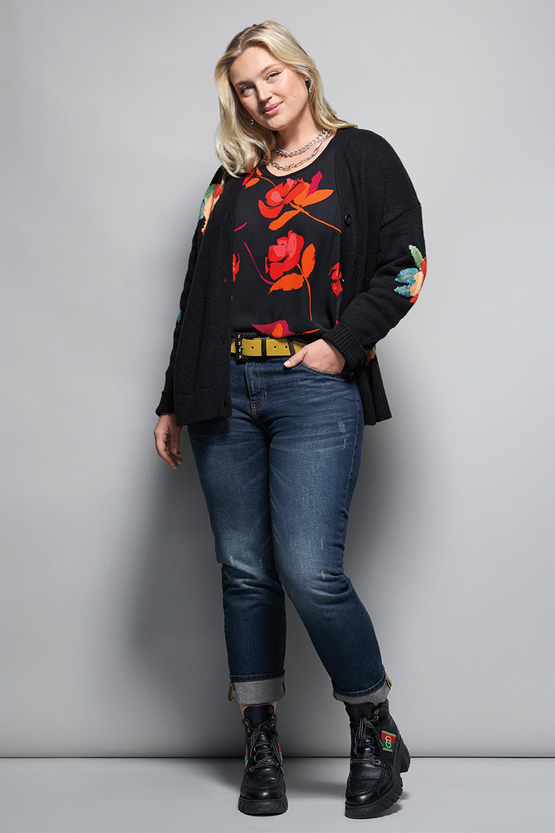 Model Wearing Coming Up Roses Cardigan in Black, New Complete Top in Floating Flowers, Malibu Jean in Authentic Wash, ID Necklace in Silver, ID Earrings in Silver, Ornament Belt in Black Combo.