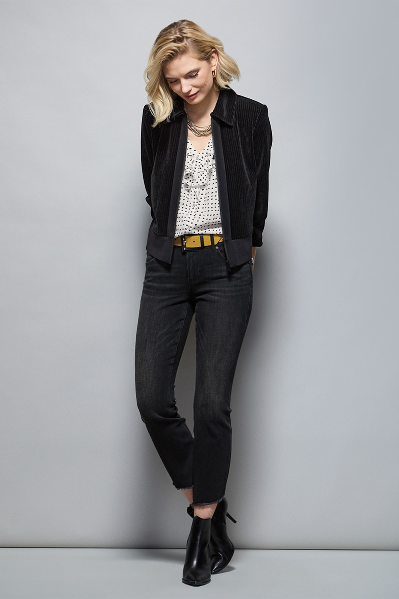 Model Wearing Team Jacket in Black, Polka Dot Top in Polka Dot, High-Low Crop in Washed Black, Ornament Belt in Black Combo, Dream Weaver Necklace in Gold, Dream Earrings in Gold.