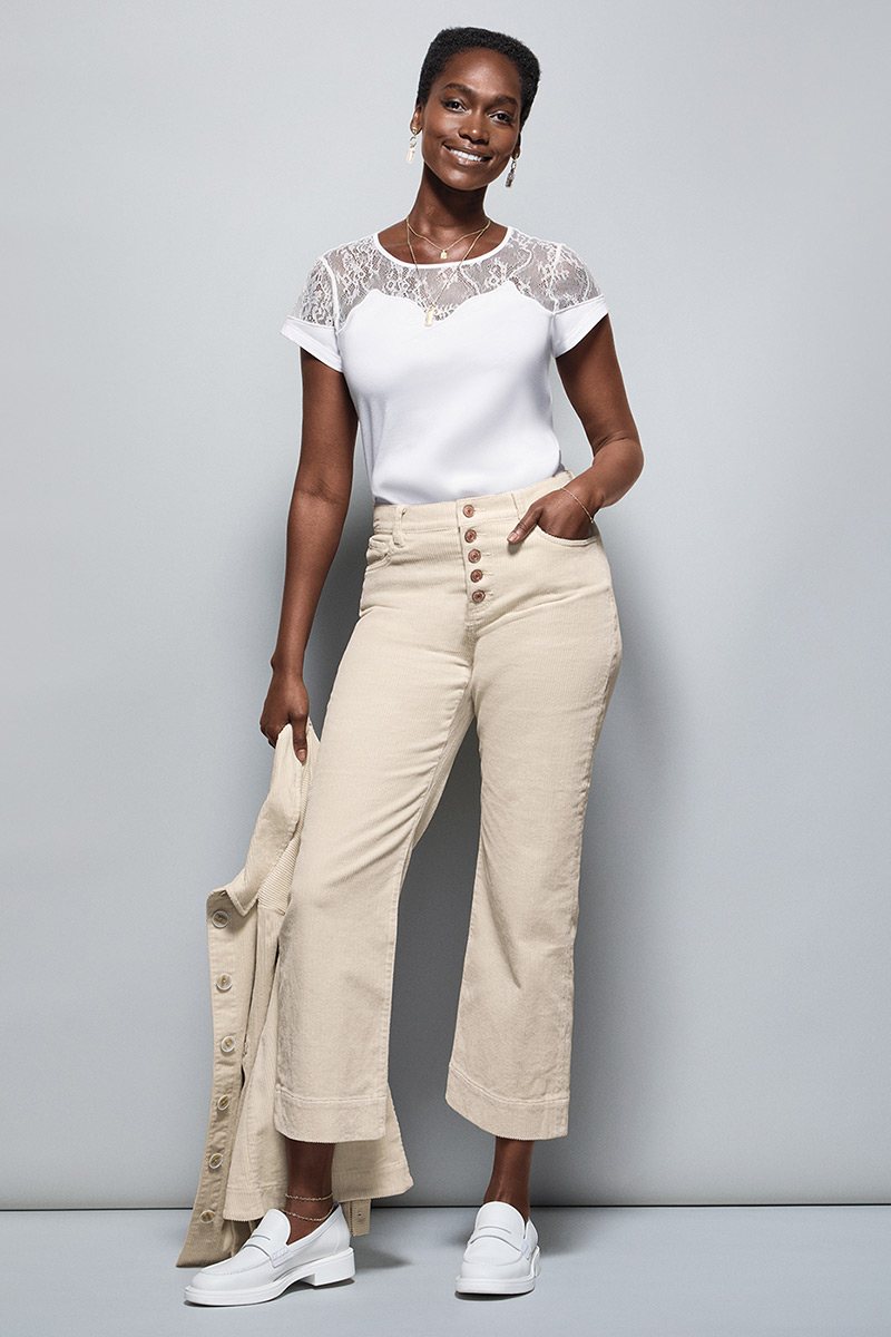 Model Wearing Flirt Tee in White, Scout Jacket in Bone, Palm Beach Crop in Bone, Fable Earrings in Gold, Fable Necklace in Gold.