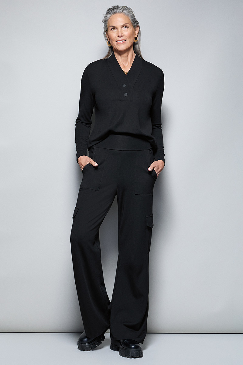 Model Wearing Ritzy Top in Black, Chargo in Black, Dream Earrings in Gold, Dream Weaver Necklace in Gold.