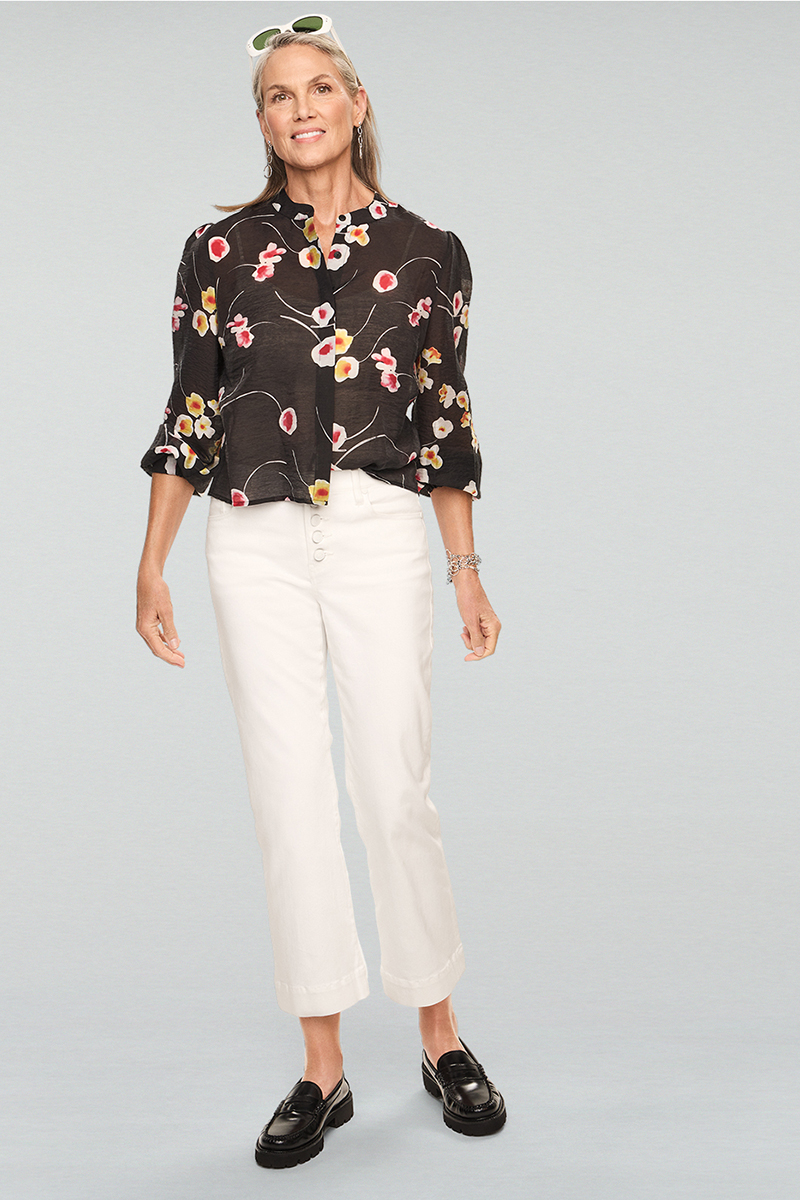 Model Wearing Greenhouse Blouse in Black Floral, Palm Beach Crop in White, Give Me a Ring Earrings in Silver