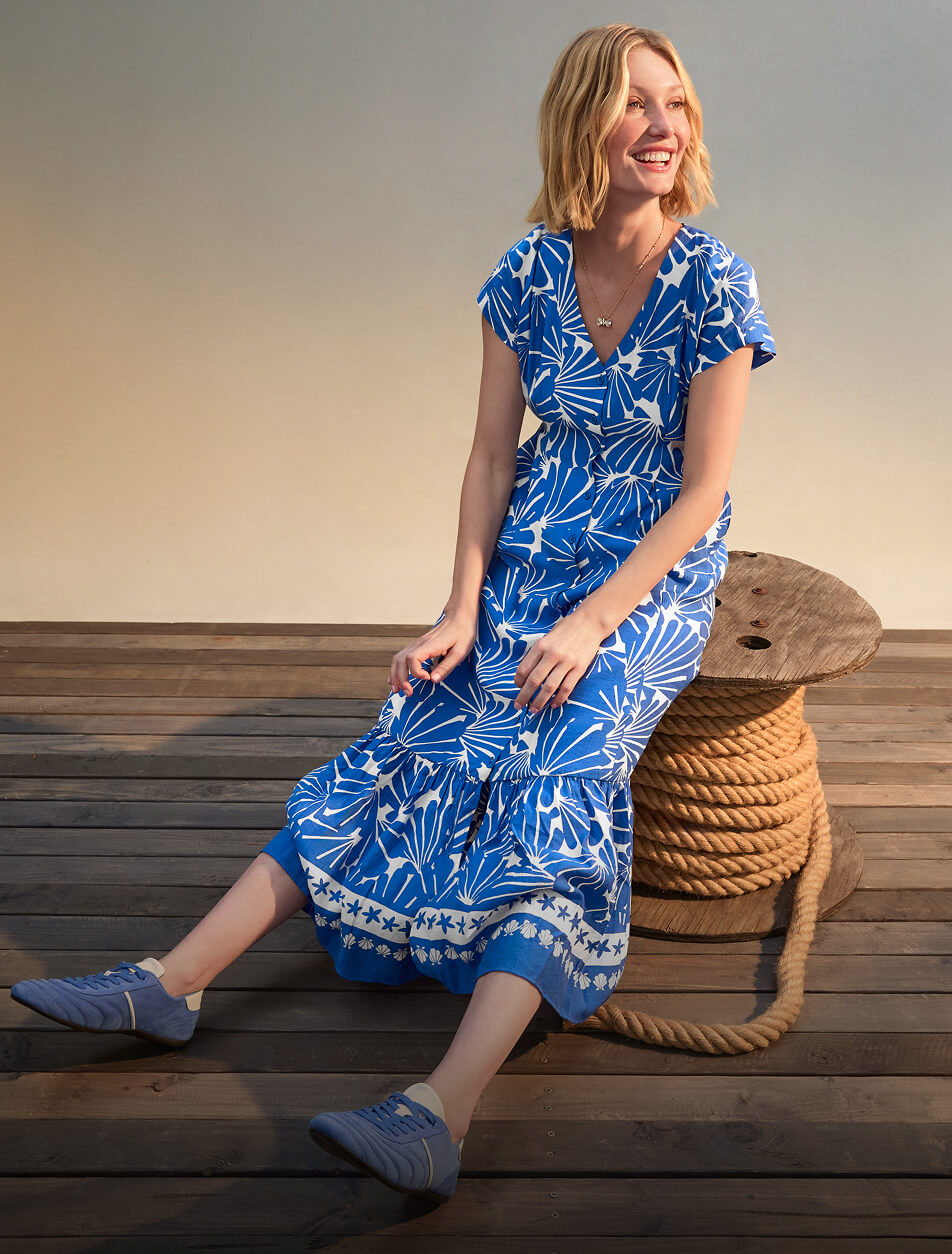 Female wearing a blue and white patterned dress